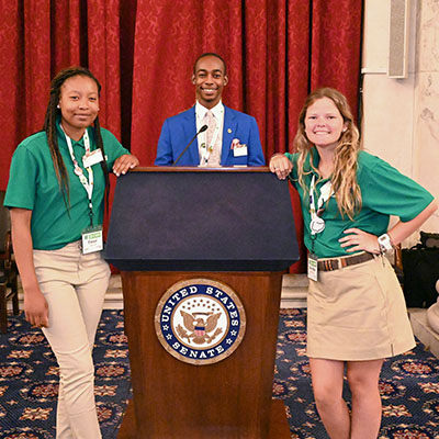 Three 4-H youth at the Senate