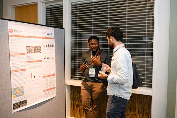 Poster presenter talking about his research