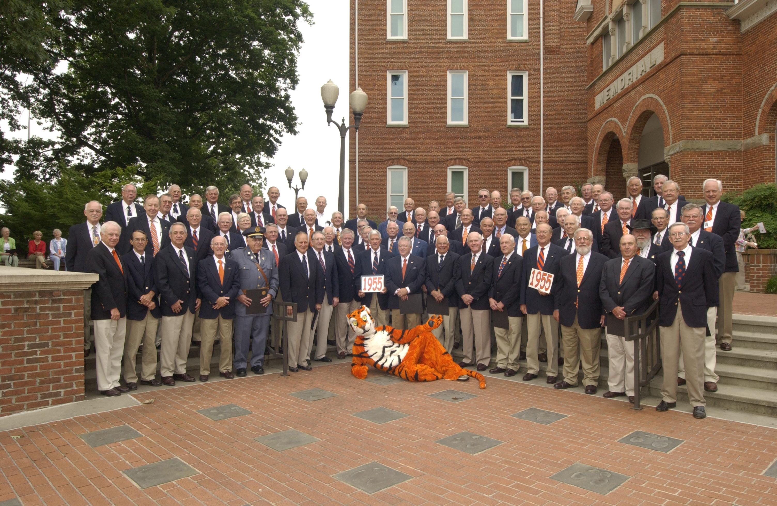 Class of 55 group photo outside on Campus grounds