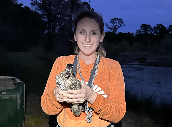 Cindy Von Haugg (M.S. Student) with a Wood Duck