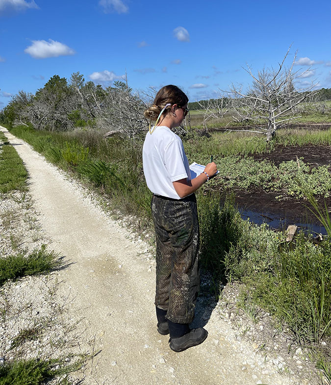 Jordan McCall (M.S. Student) conducting waterbird point count