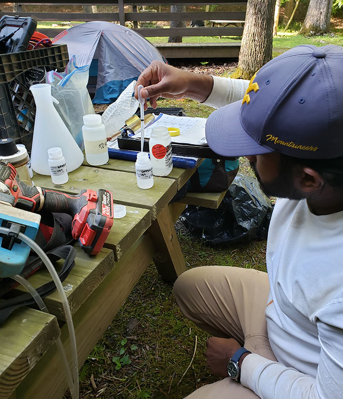 Sindupa De Silva (Ph.D. student) testing wetland water quality