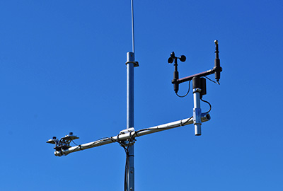 weather antenna with blue sky background