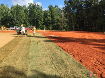 clemson students installing sod