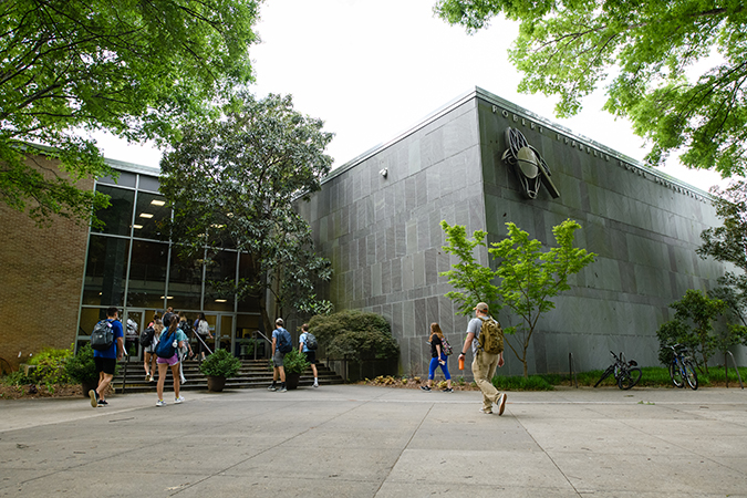 students walking in front of the poole and agricultural center building