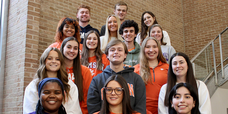 students in the advisory board talking at a table