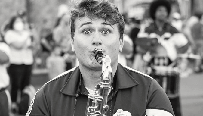 Charlie Brooks-Knepfle playing saxophone in the Disney All-American College Band