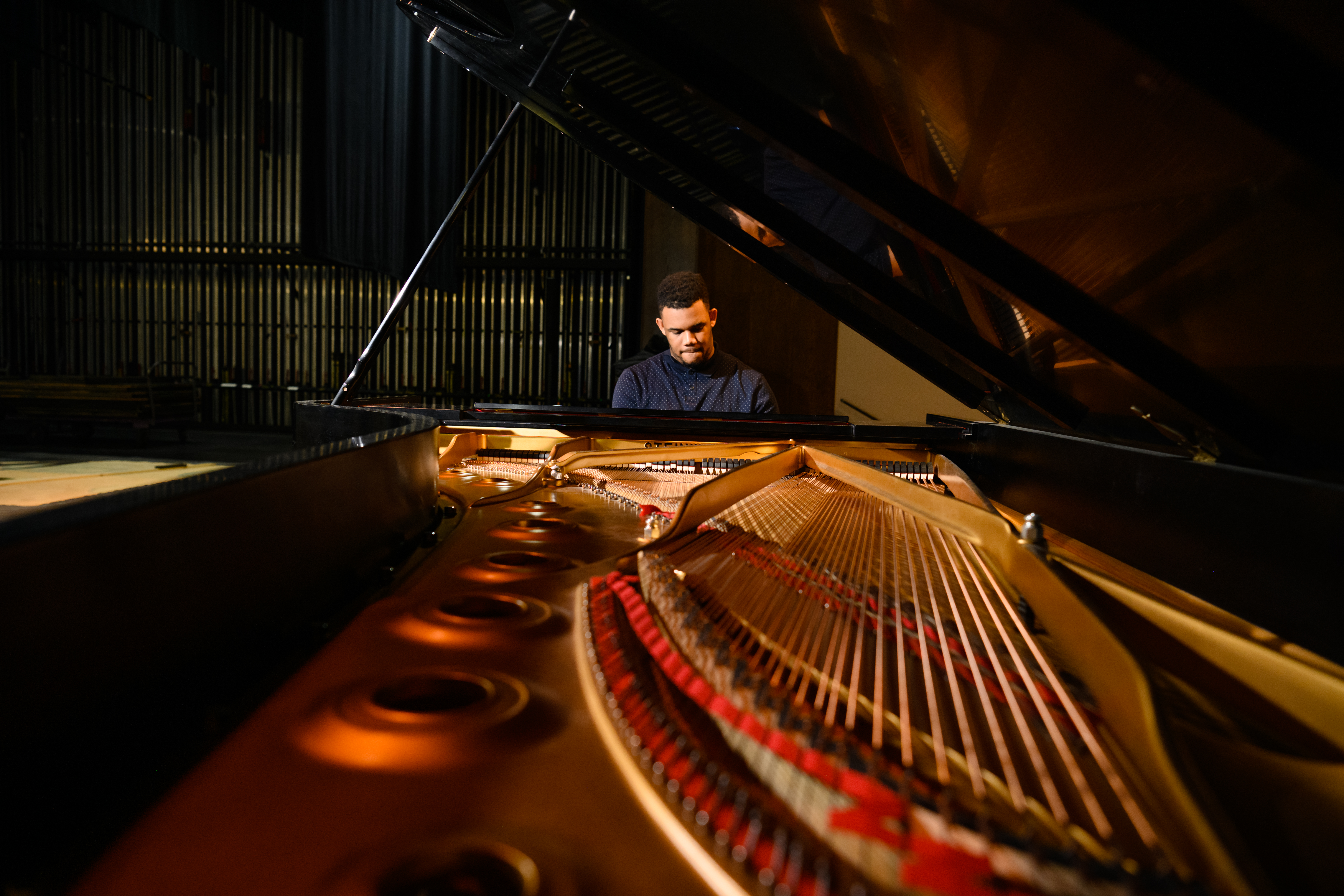 Student Christian Walker plays on a Steinway Piano on the Brooks Center Stage