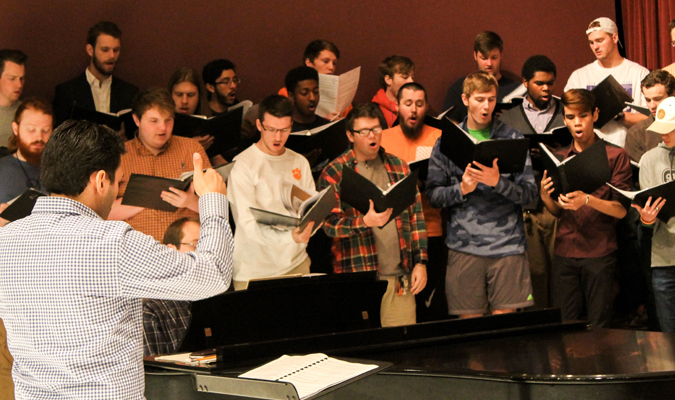 Anthony Bernarducci conducts members of Men's Choir