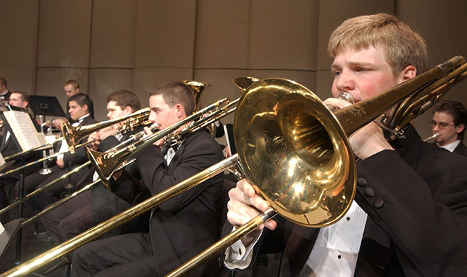 Student plays trombone as part of the symphonic band