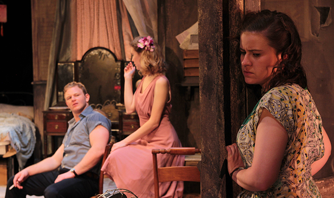 Students listen at door during scene from 'A Streetcar Named Desire'