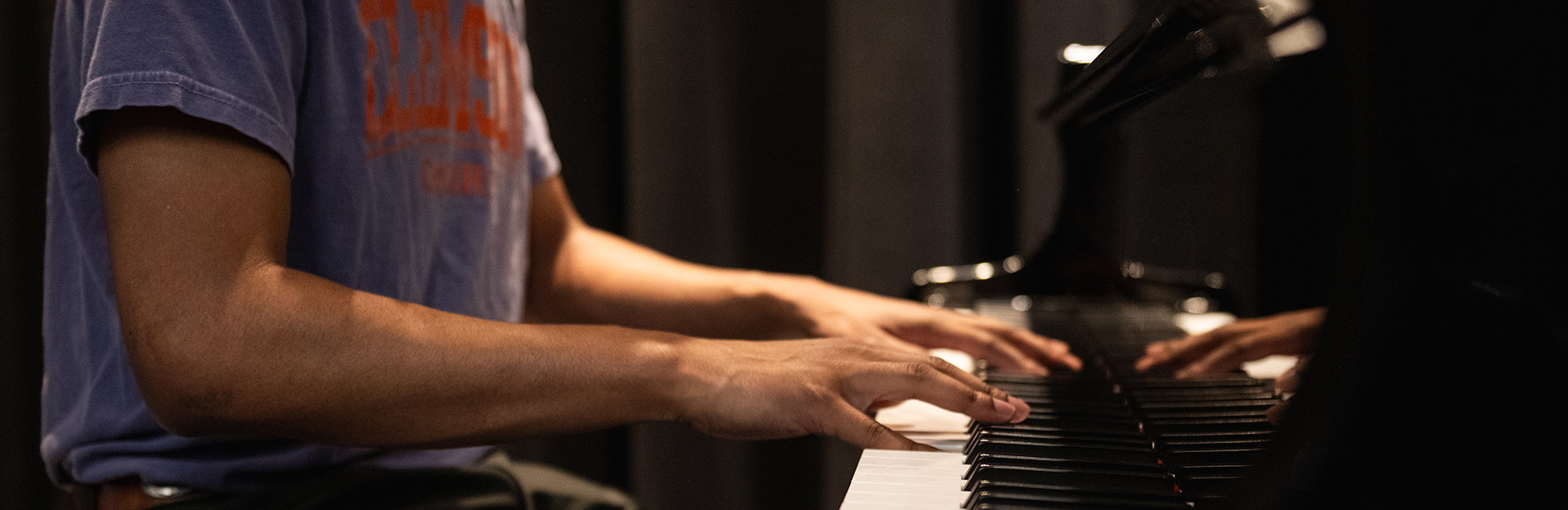 a performer plays the piano