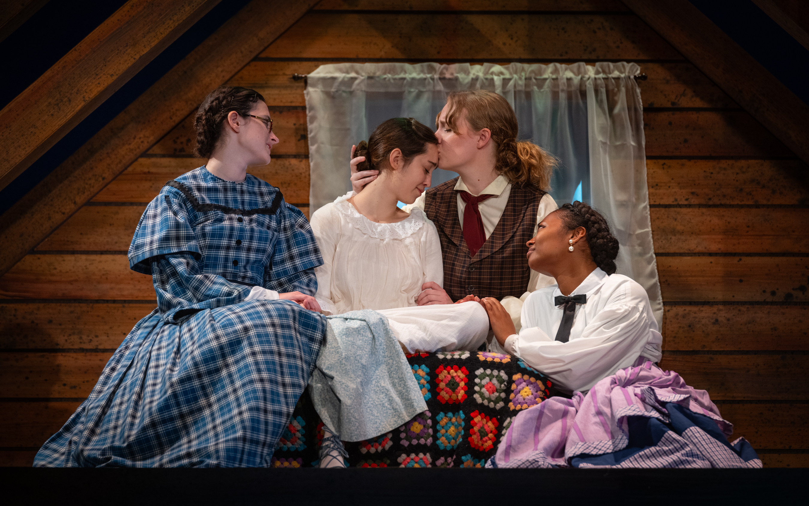 The March sisters embrace in a production of Little Women by the Clemson Players