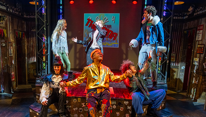 Student perform in a colorful theatre production
