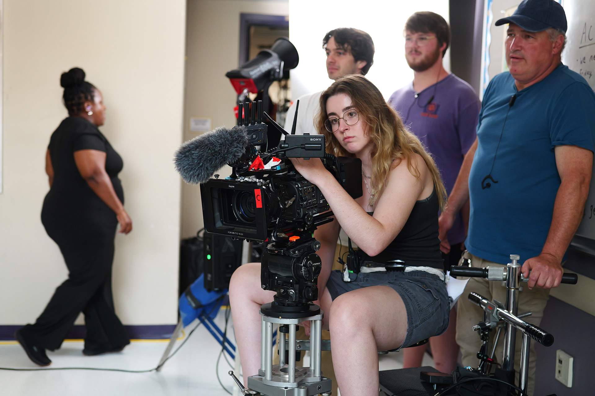 a person looks into a video camera