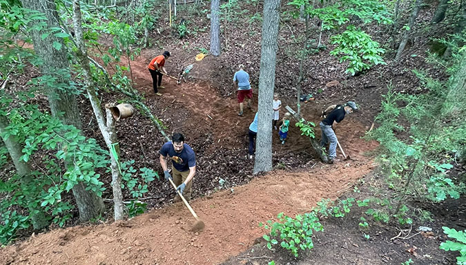 volunteers doing trail work