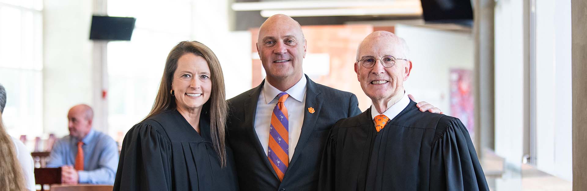 Judges Gary Clary and Lindsey Simmons stand next to President Clements for a photo after being sworn in.