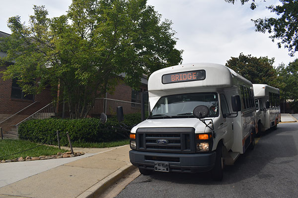 Bridge transit bus waiting at a bus stop.