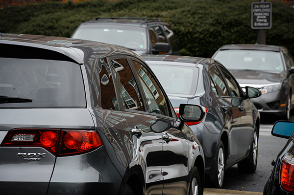 Several cars in a parking lot. 