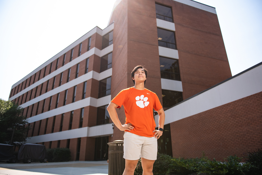 Prospective Clemson nursing student standing outside Edwards Hall, home of the School of Nursing