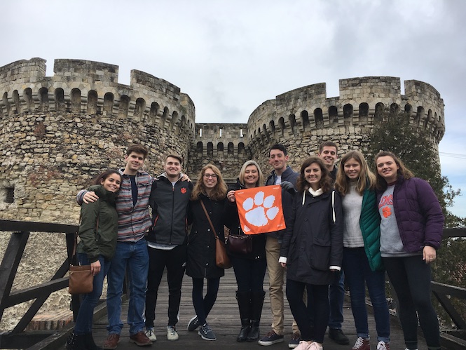 Clemson Students holding a Clemson pennant in Belgrade