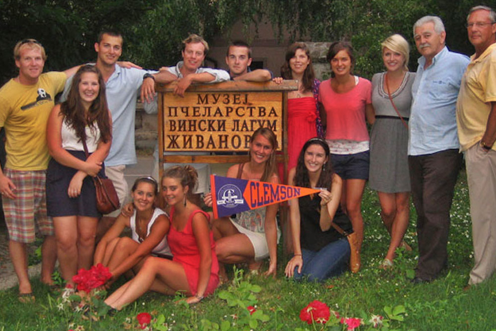 Clemson Students holding a Clemson pennant in Belgrade