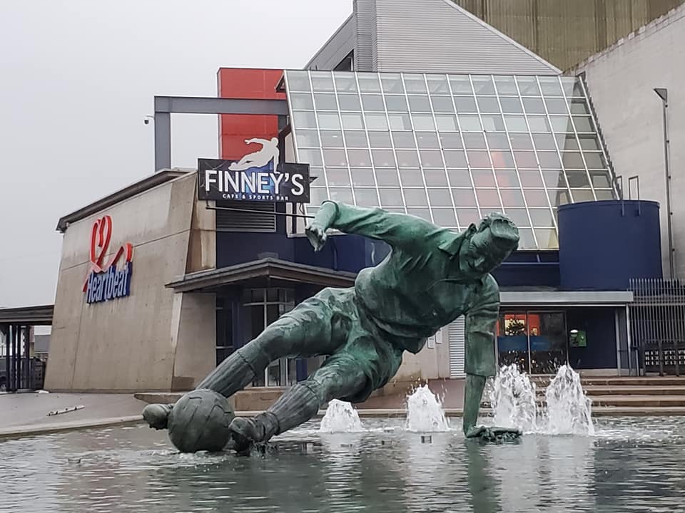 Photo of a monument outside a sport stadium.