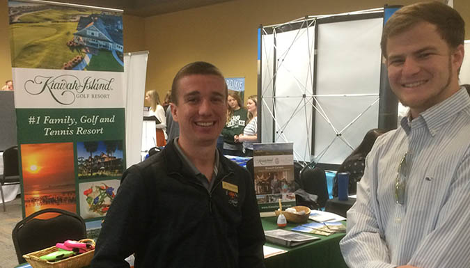 Former students talking to Kiawah Resort rep at the 2018 career fair.