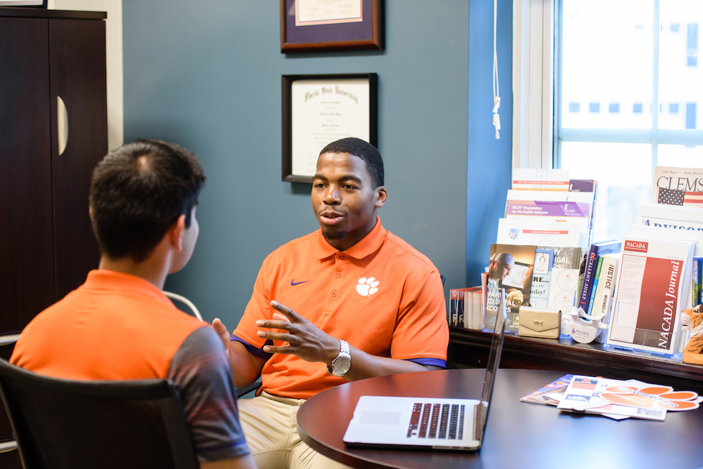 Academic advisor talking to a student