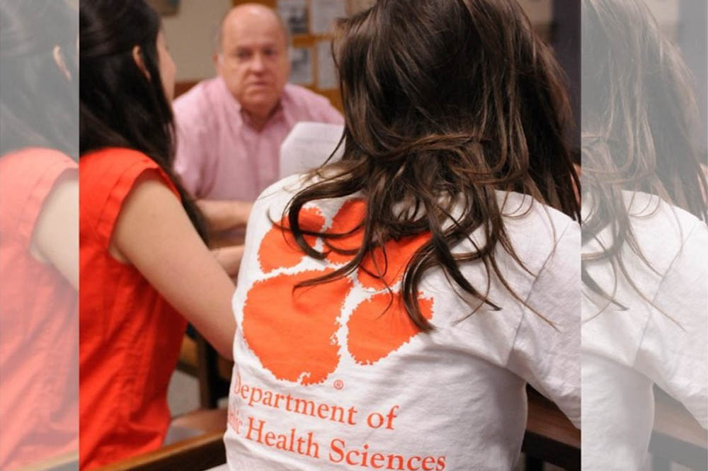 Students in a Clemson Public Health Science classroom with a faculty member