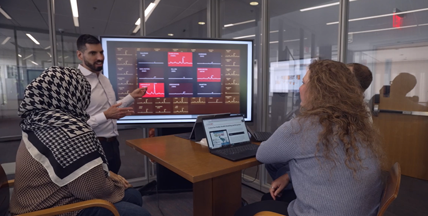 Scientist looking over public health research data