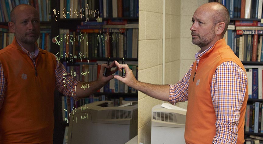 faculty looking at equations