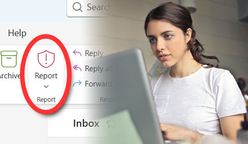 Woman working on computer with the Report button in Outlook highlighted