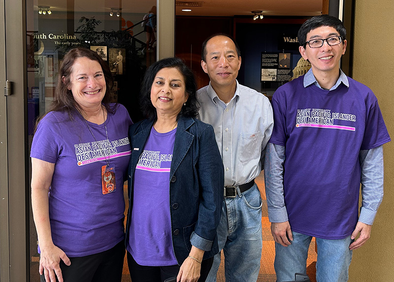 Commission members wear matching purple APIDA t-shirts