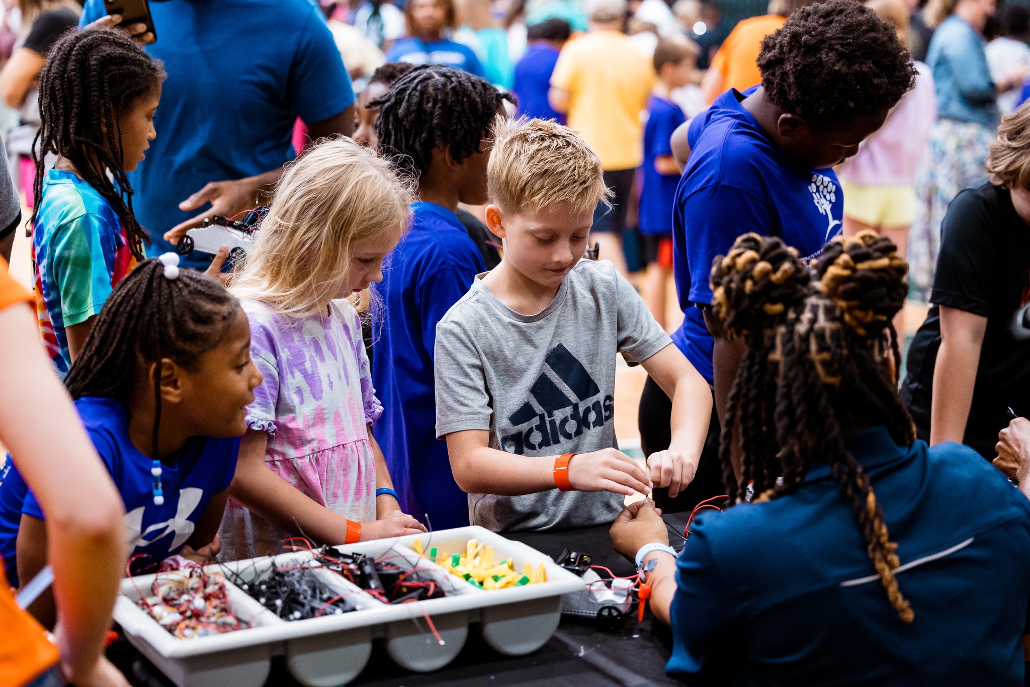 Image of a young boy connecting wires to complete a project at a STEM SC event