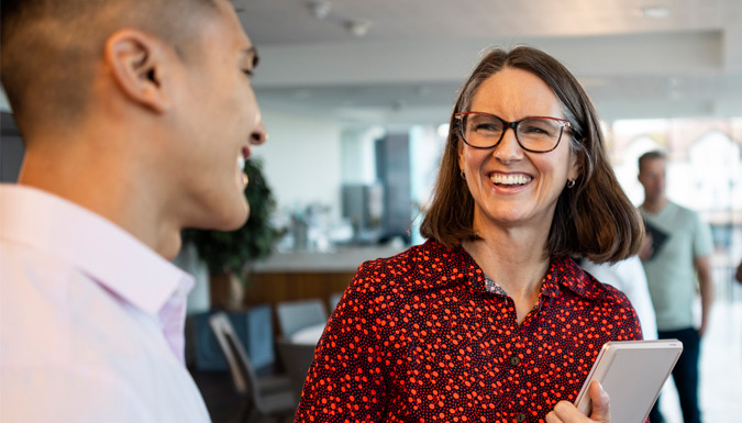 A group of teachers networking in an office.