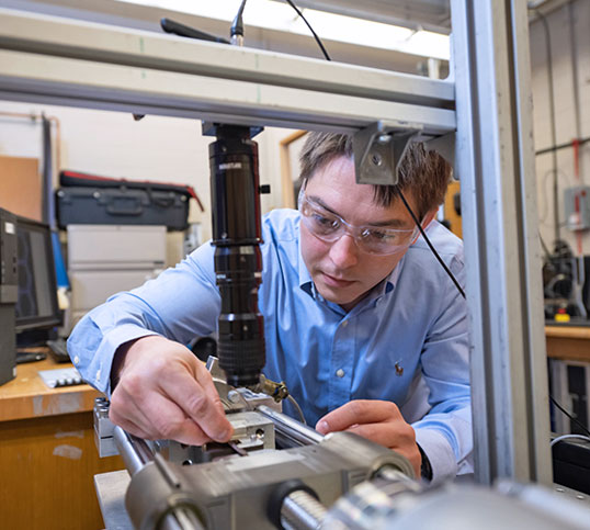 Student on machine in lab