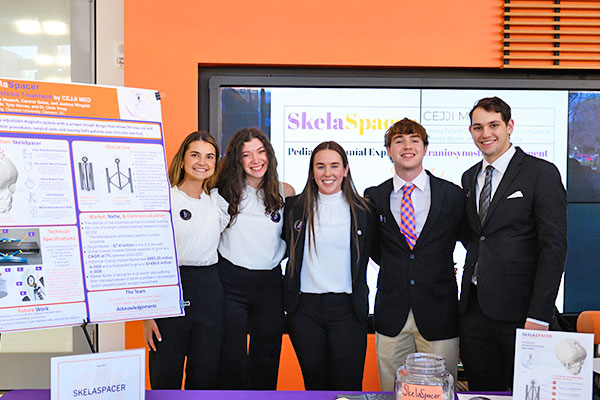 Spark Challenge group in Watts with their invention, the Skelaspacer.