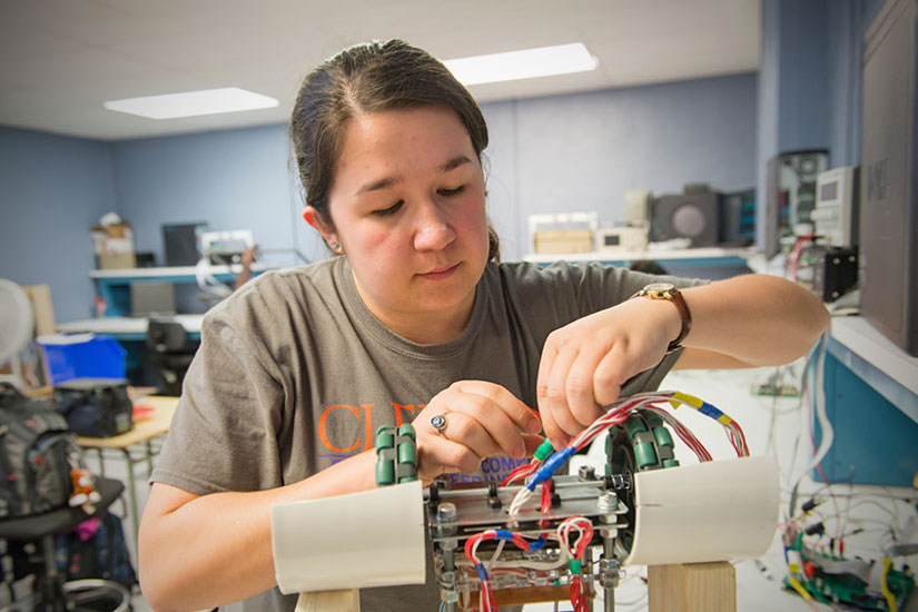 Student in lab with electronics