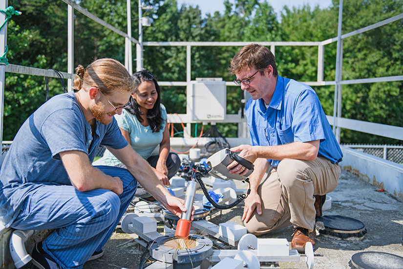 Faculty member with students outside