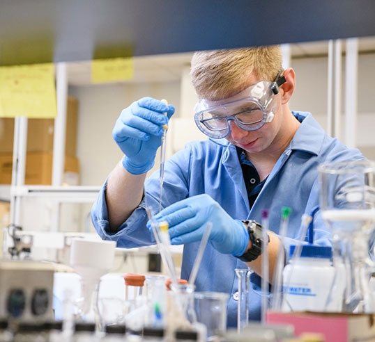 Student in lab with equipment