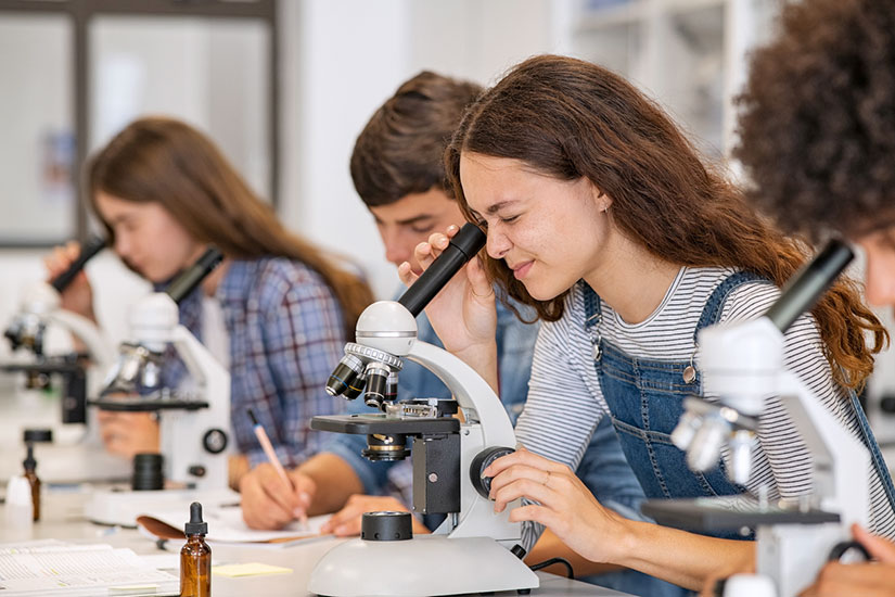 Students in lab at microscope