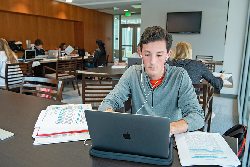 Students studying inside honors college space