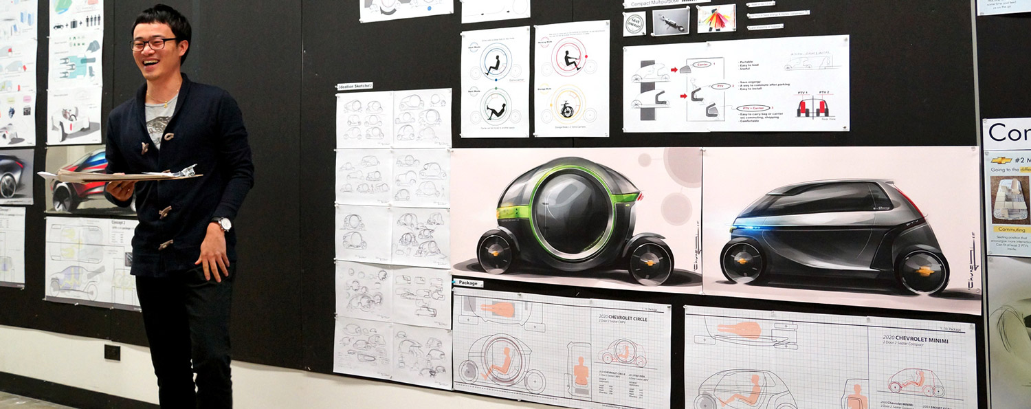 Student presenting concept vehicle