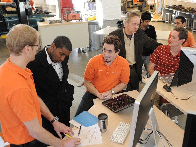 Students discuss plans for their concept vehicle