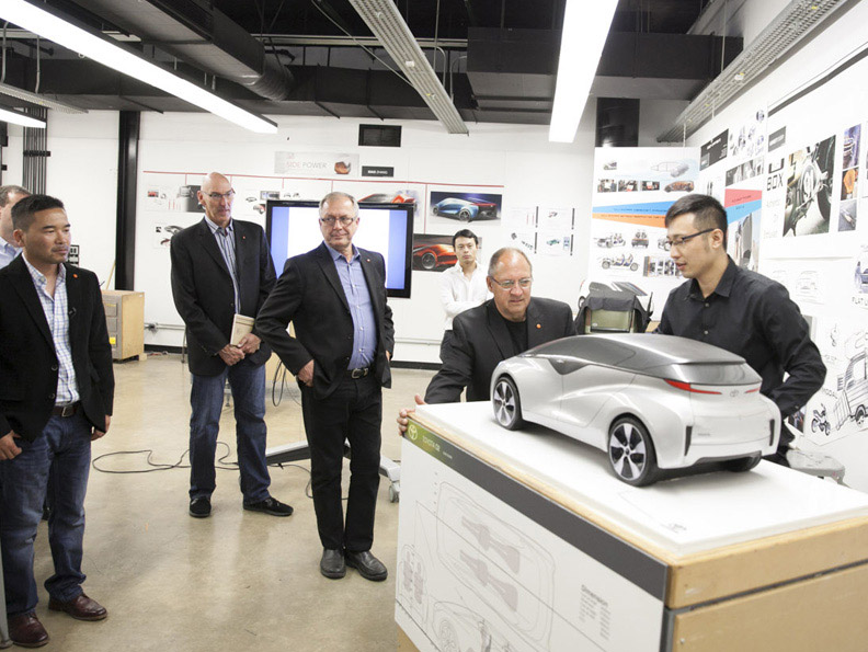 Deep Orange Team examines a model of the concept vehicle