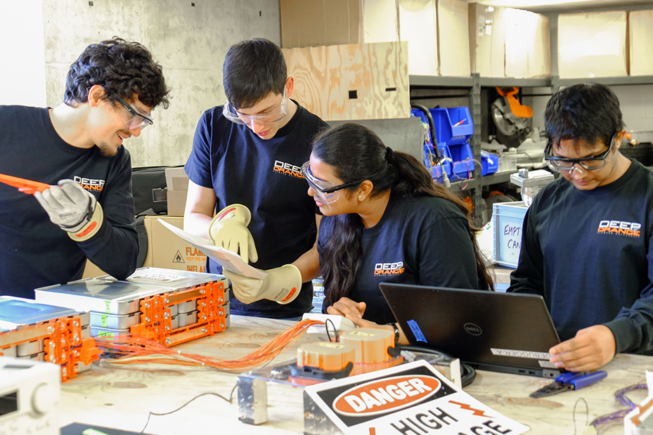 Team of students perform tests on vehicle components