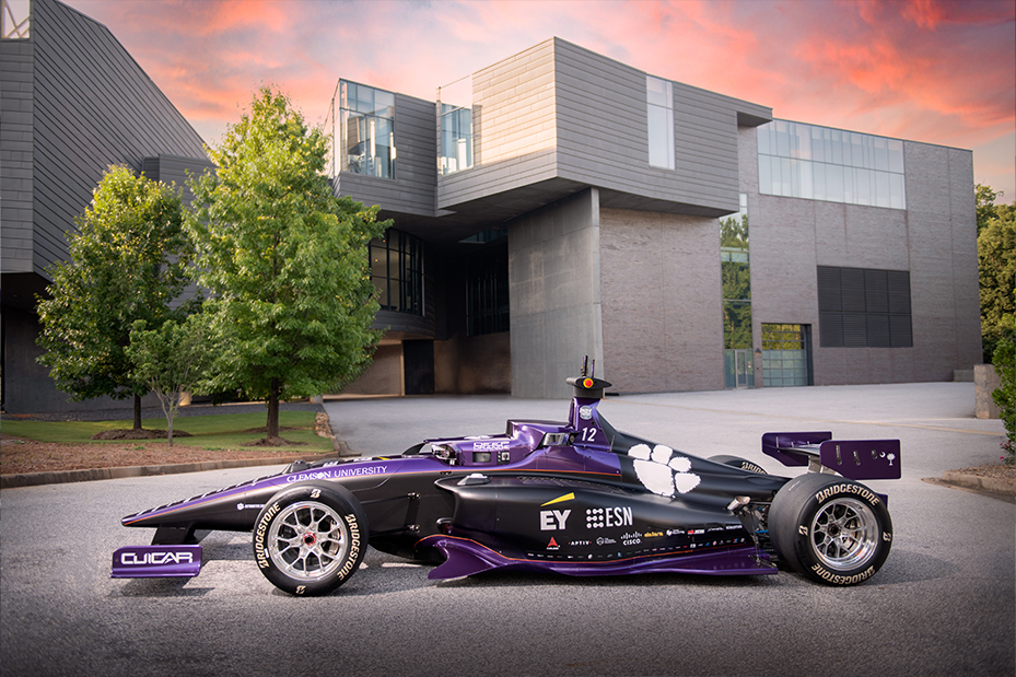 Completed DO12 Autonomous Indy Car sits in front of a building