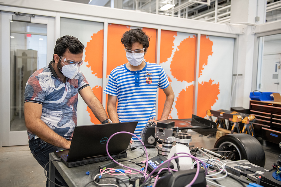 Two students examining test data