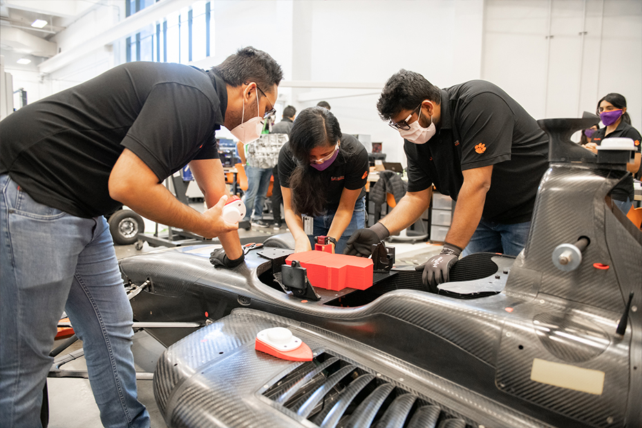 DO12 team working on the vehicle
